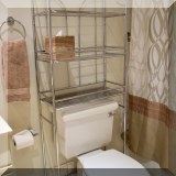 F63. Metal over-toilet shelf. 65”h 24”w x 10”d - $12 